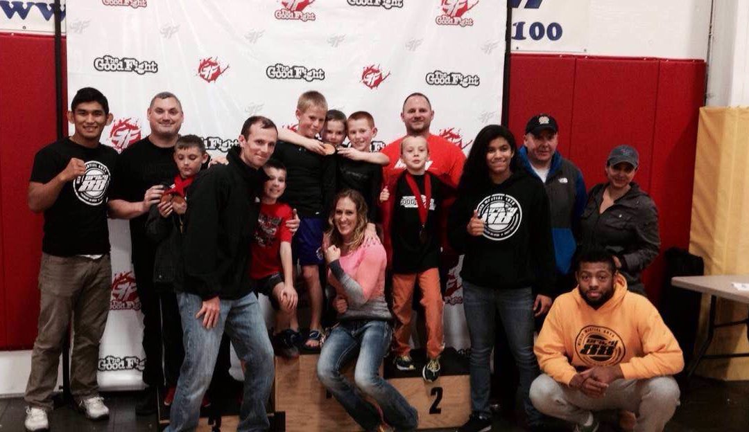 Crazy 88 parents, kids, and coaches on the podium celebrating a successful day.