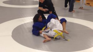 High school freshman, Jana Tumaneg, locking up a tight triangle.