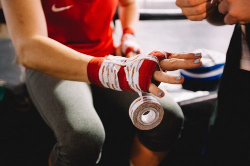 Female boxer getting ready to fight - dylan-nolte-588372-unsplash