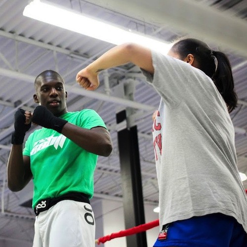 Two men practicing boxing