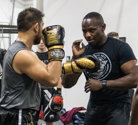 Two men practicing boxing