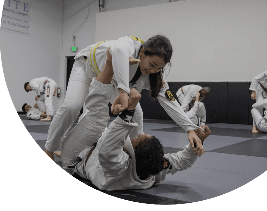 Two people training jiu-jitsu