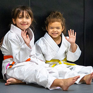 two young girls in jiujitsu class