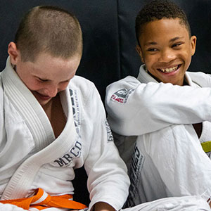 Boys laughing in jiu-jitsu class