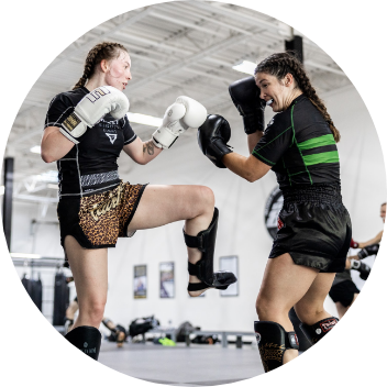 2 ladies practicing muay thai