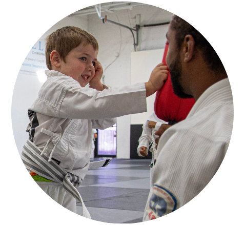 Boys laughing in jiu-jitsu class