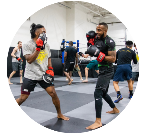 2 ladies practicing muay thai