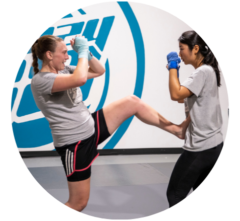 2 ladies practicing muay thai