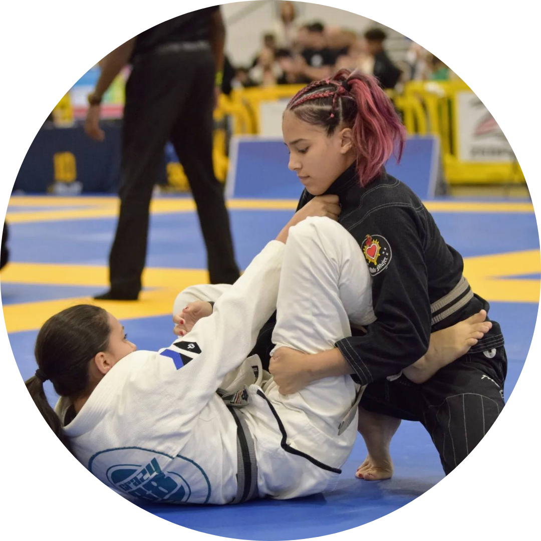 Muay Thai champ in the ring after a win, arm raised high